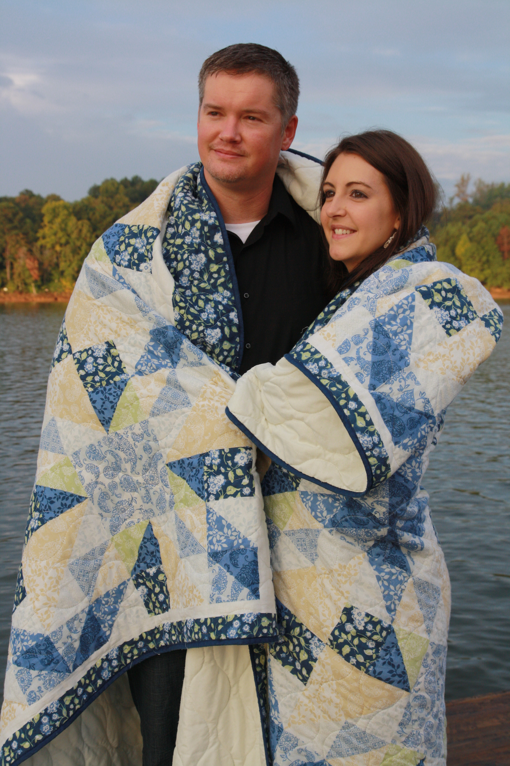 Pryse and Rachel wrapped up in blanket standing at the lake edge