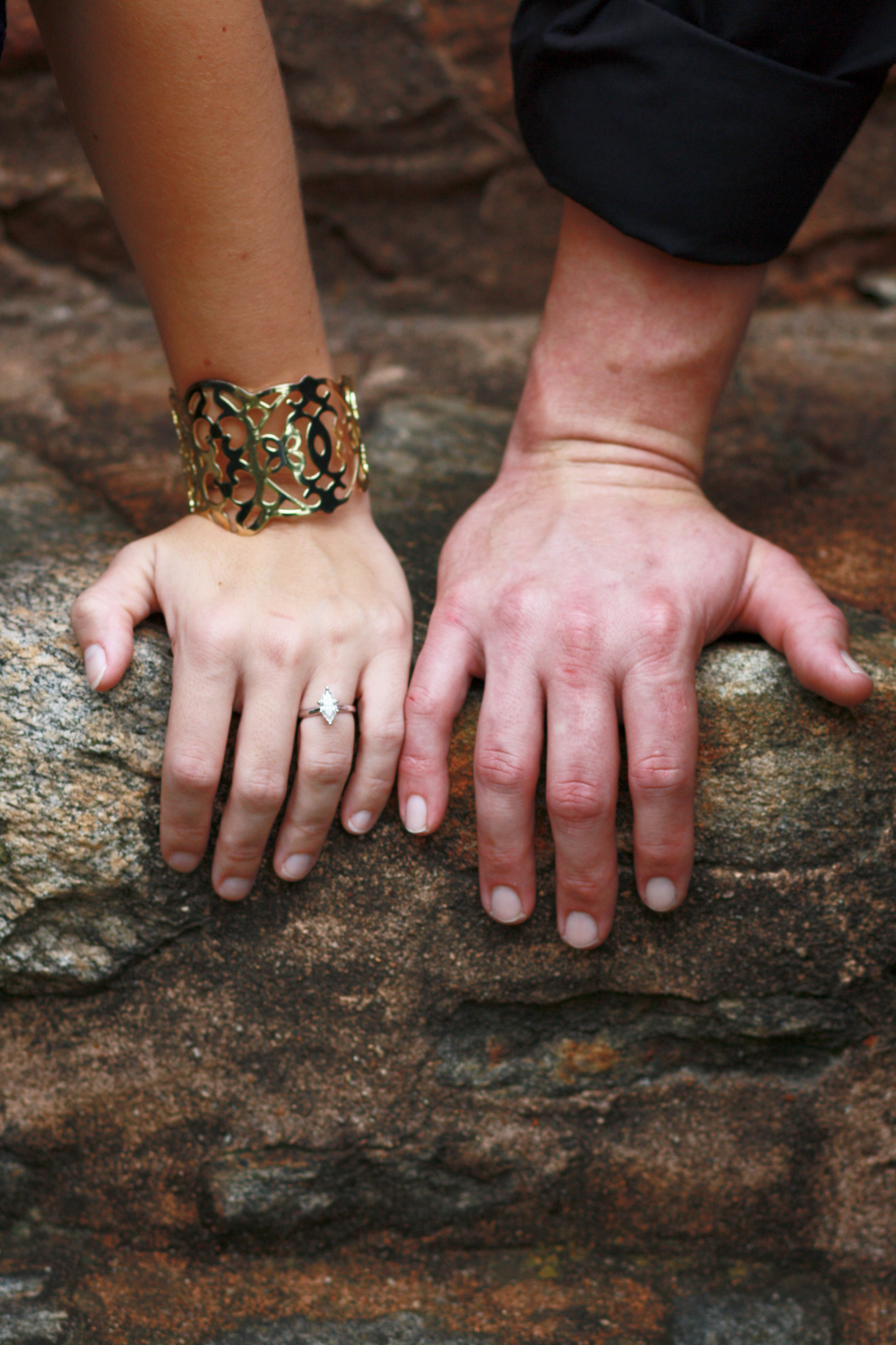His and Hers Hands with her showing engagement ring