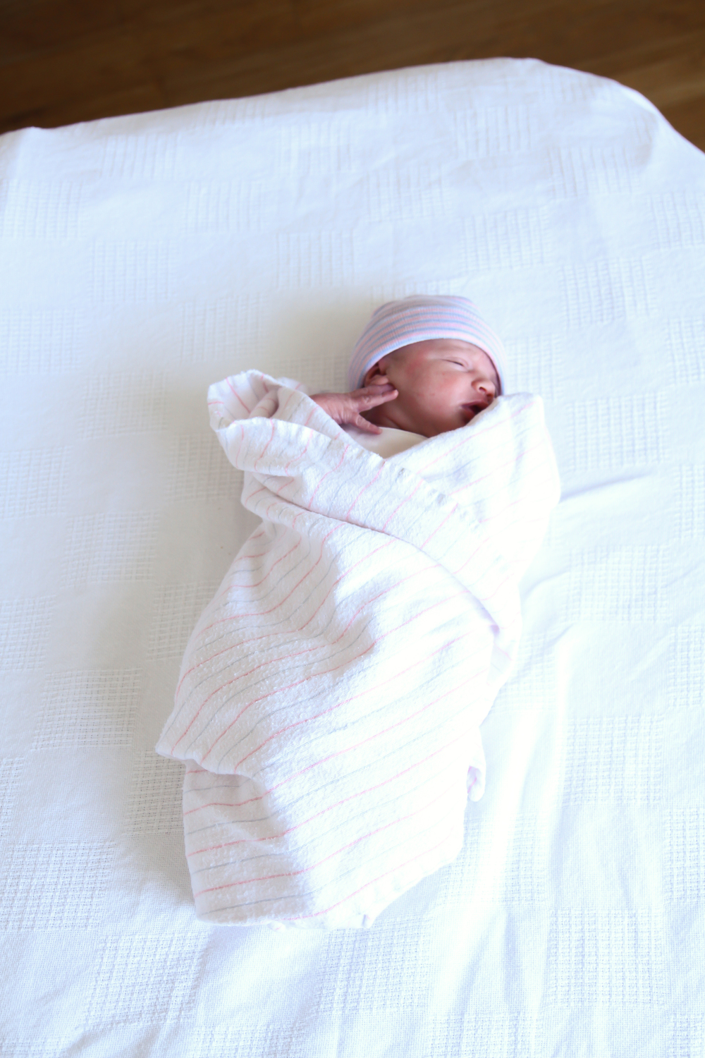 Newborn laying in crib