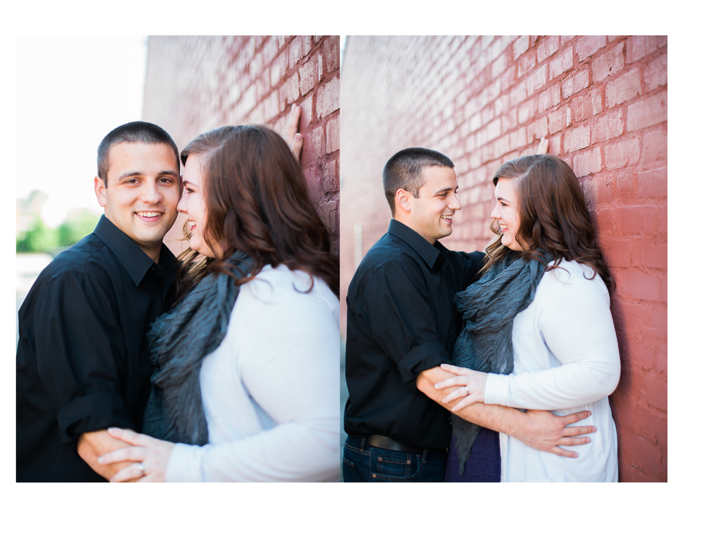 Smiling Couple against red brick wall
