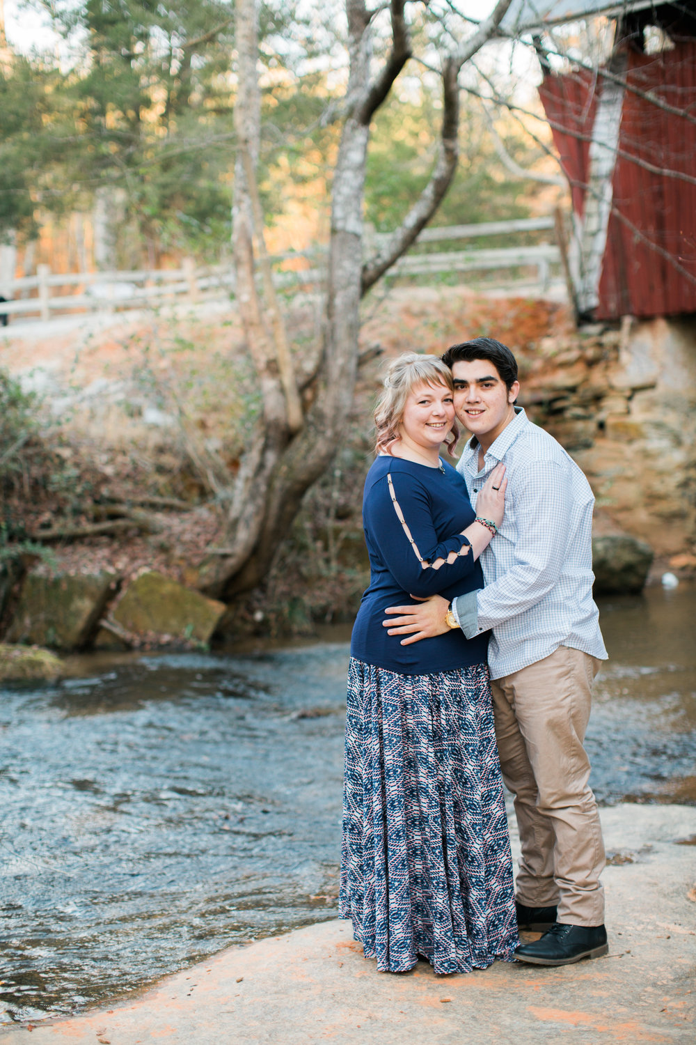 Couple in front of stream