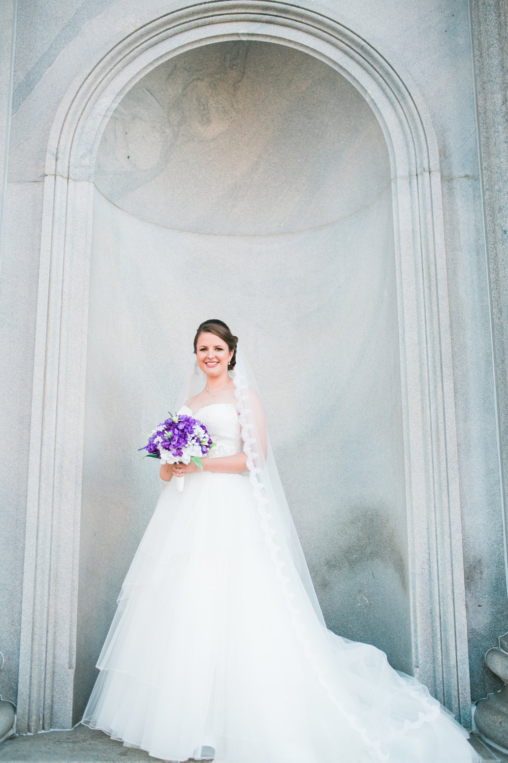 Bride with Flowers on porch of statehouse