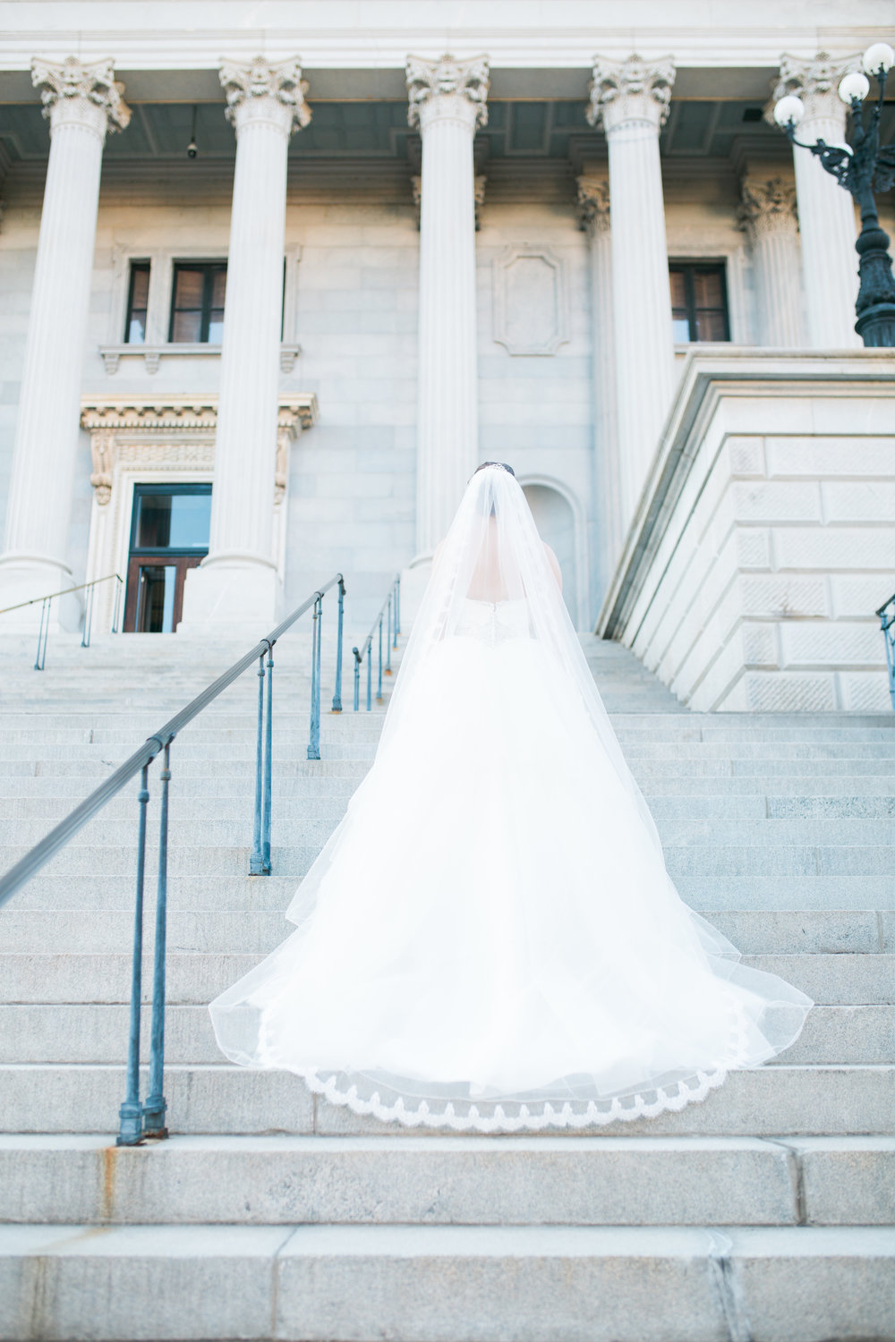 Back of Wedding Dress Photo on Steps with train down.
