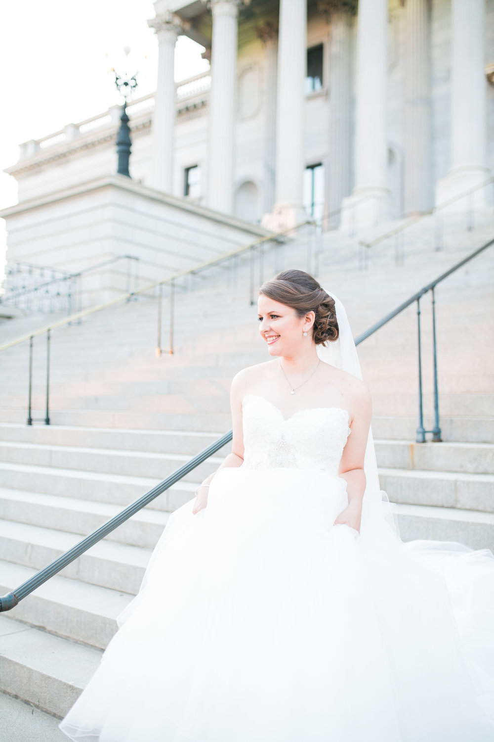 Bride on steps of Statehouse in Columbia SC