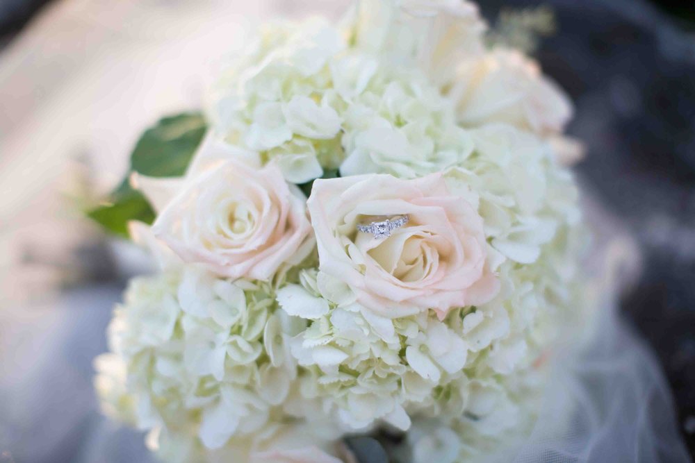 Wedding Bouquet with Ring sitting in Rose