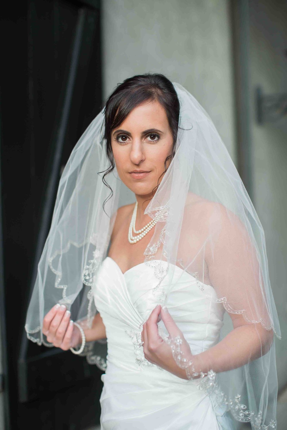 Bride holding veil