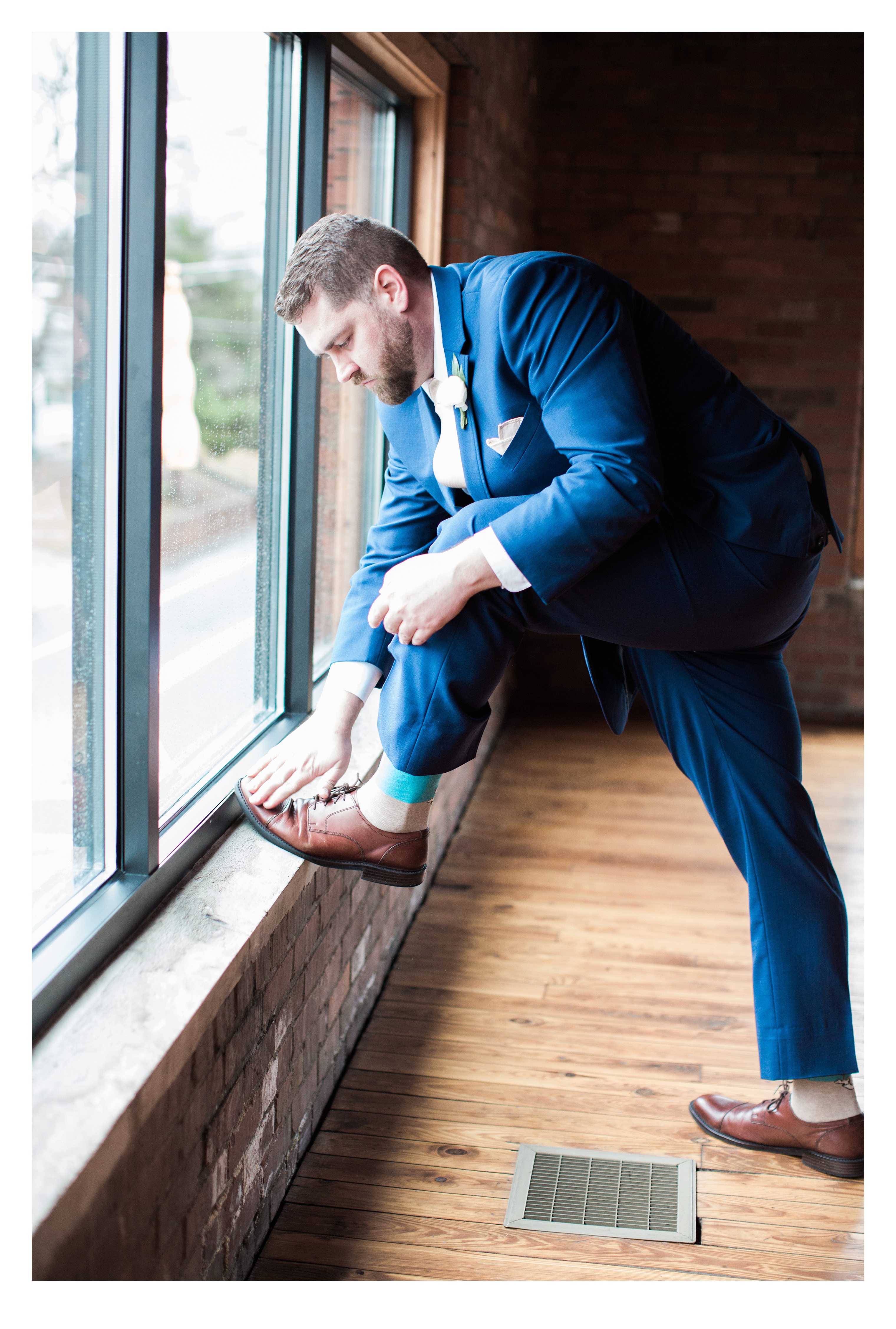 The Groom putting on his shoes