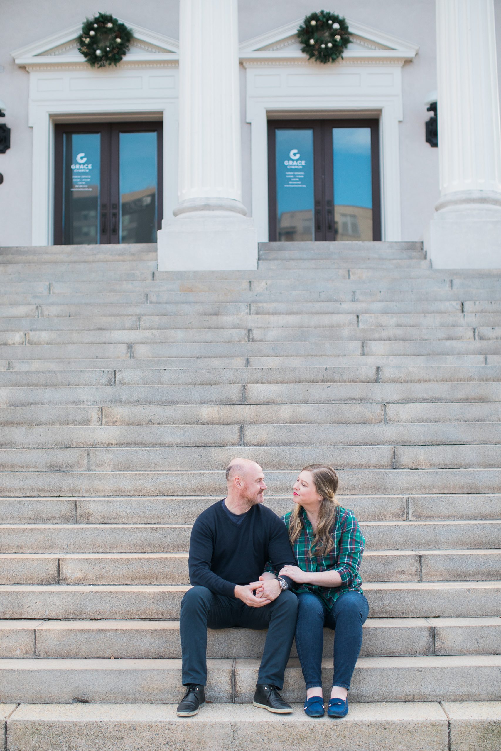 Couple sitting on Steps in downtown Greenville