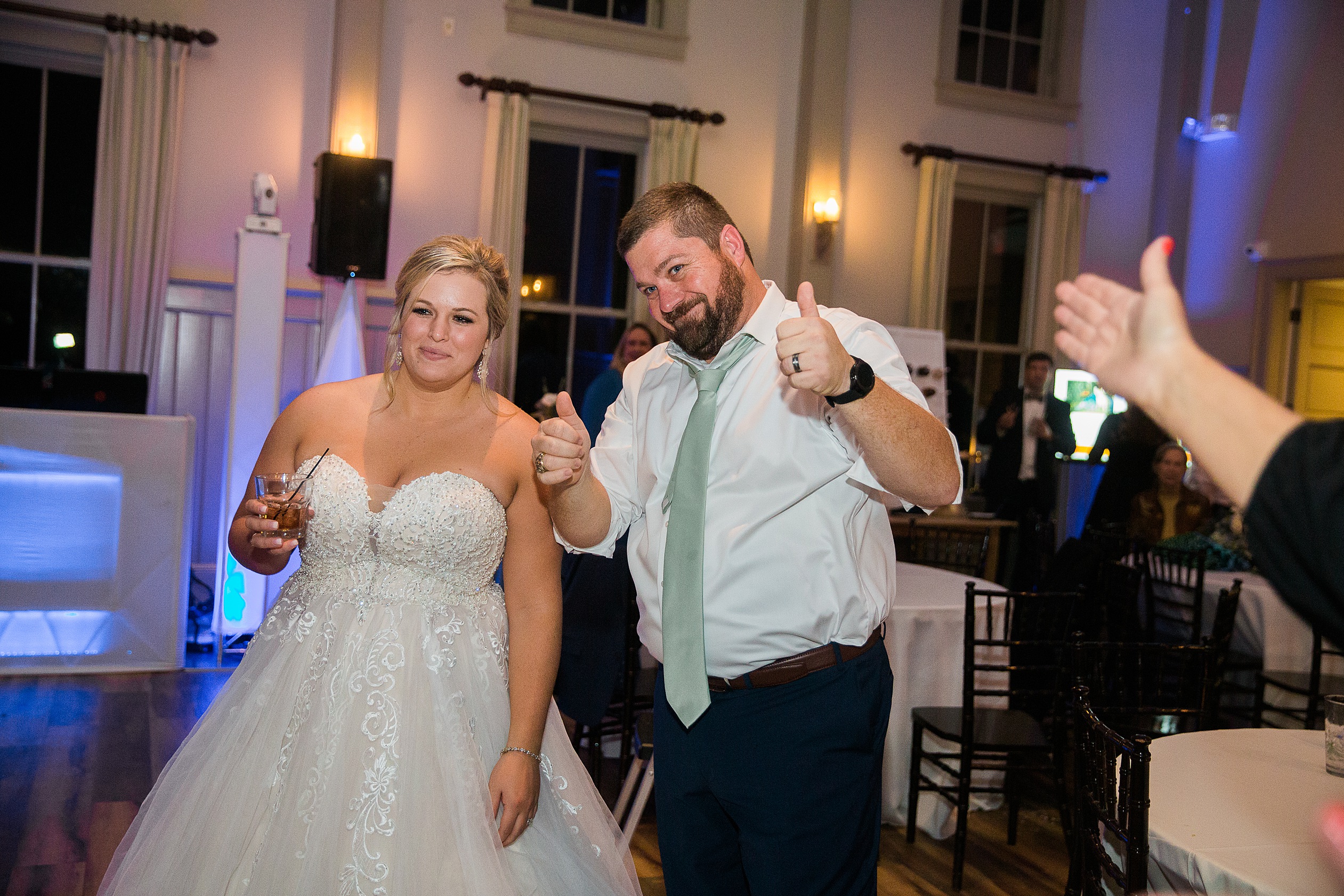 Bride and Groom giving thumbs up