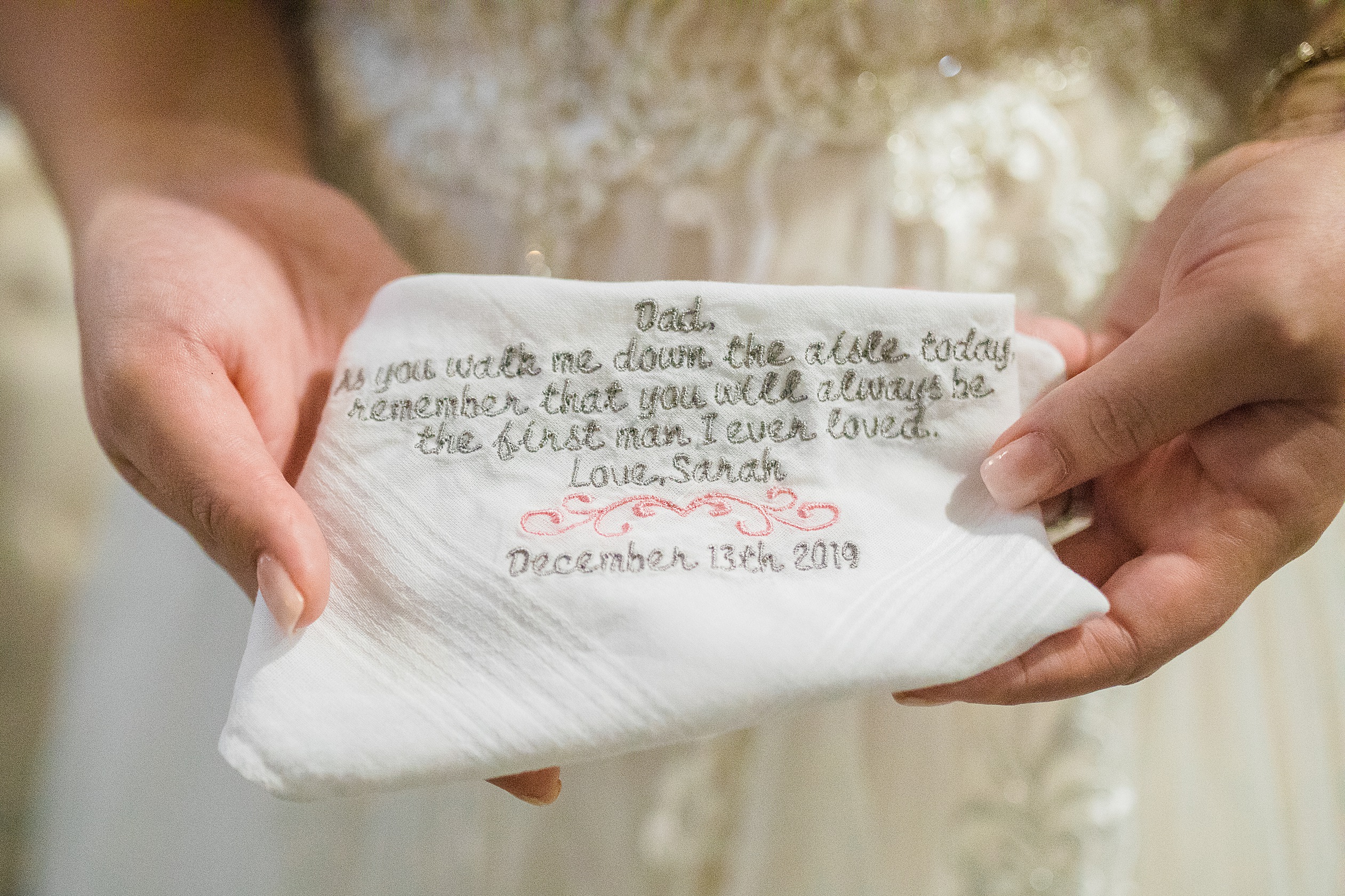 Bride showing a gift to her Dad