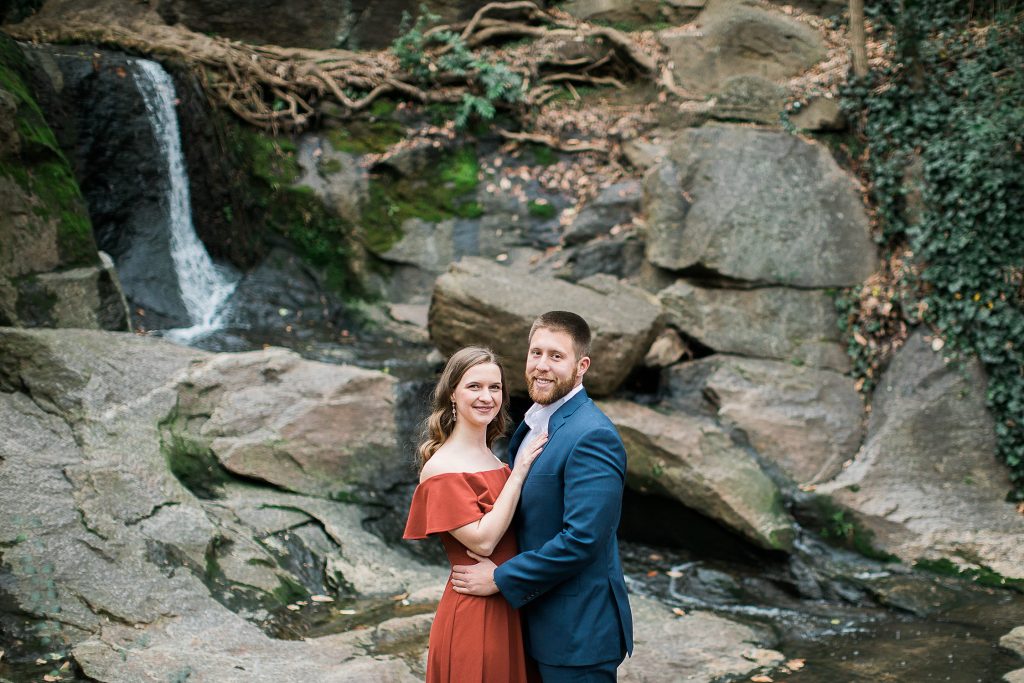 Couple in front of small waterfall