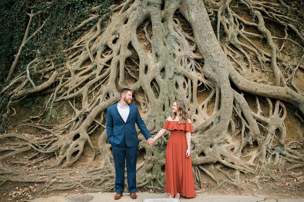 Couple in front of exposed tree roots