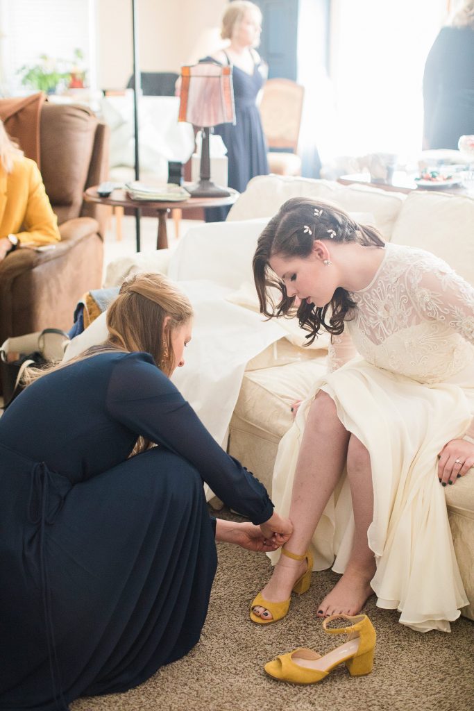 Bride Putting on Shoes