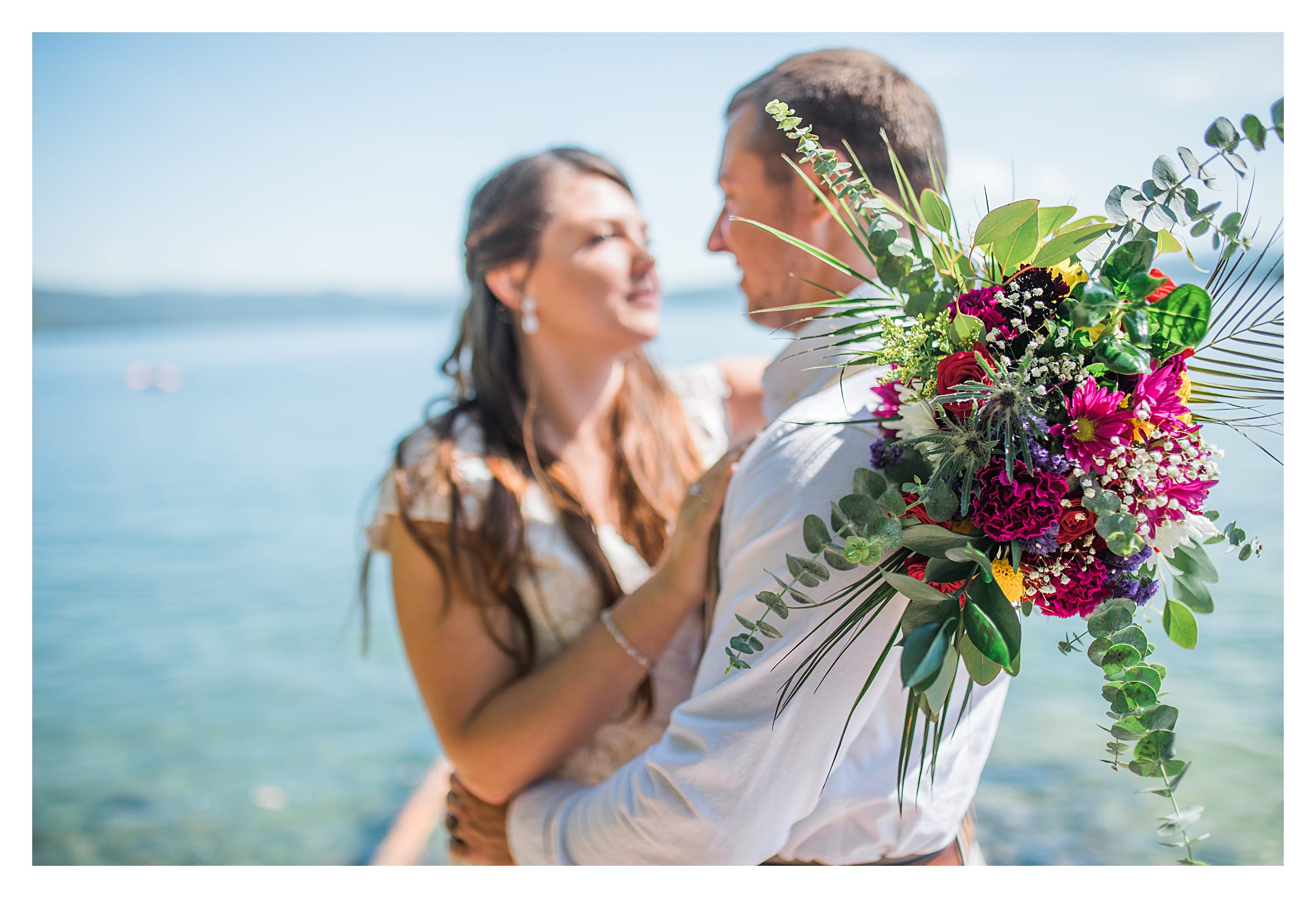 couple-by-lake-with-flowers