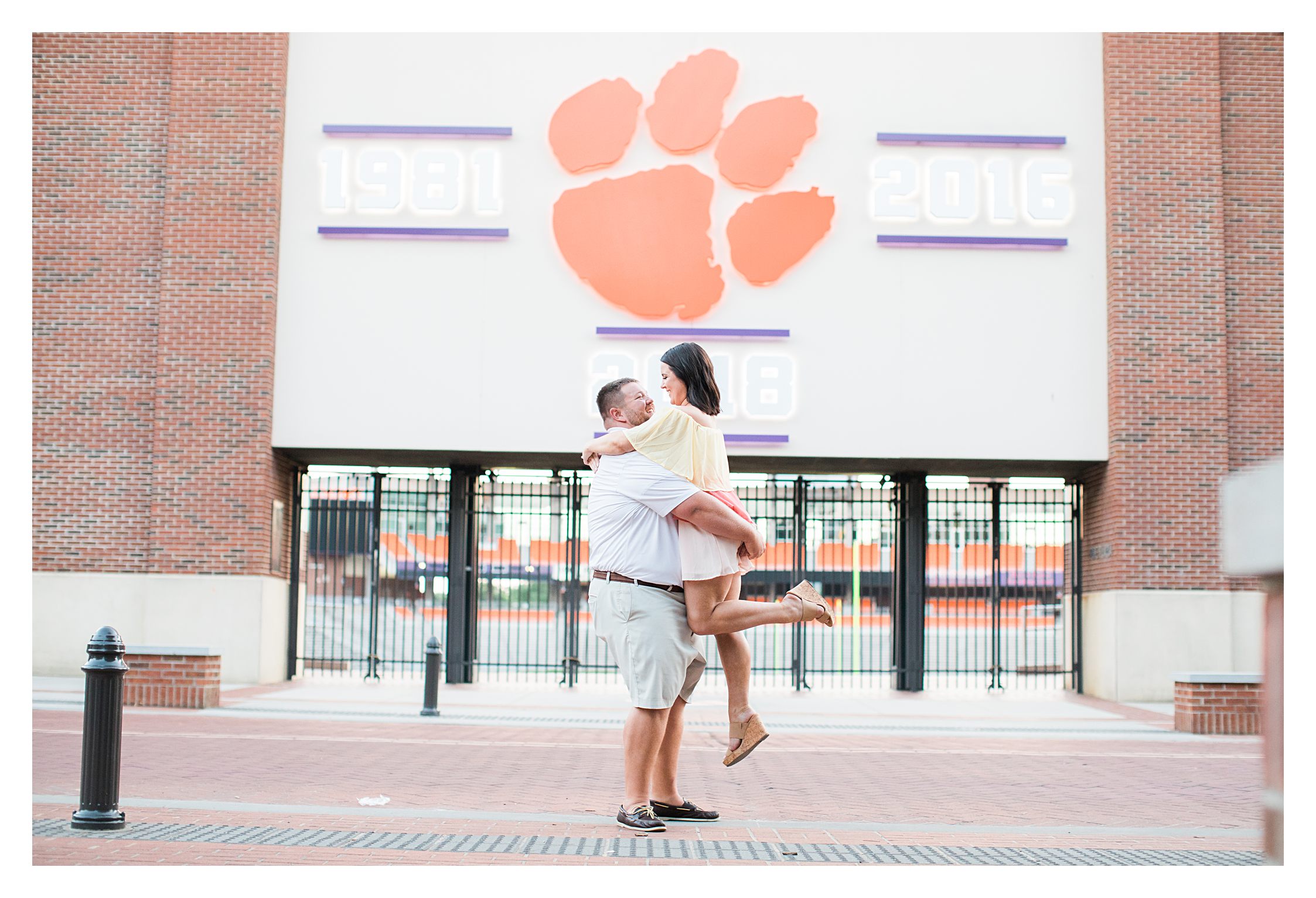 Picking up his future bride of the ground at Clemson