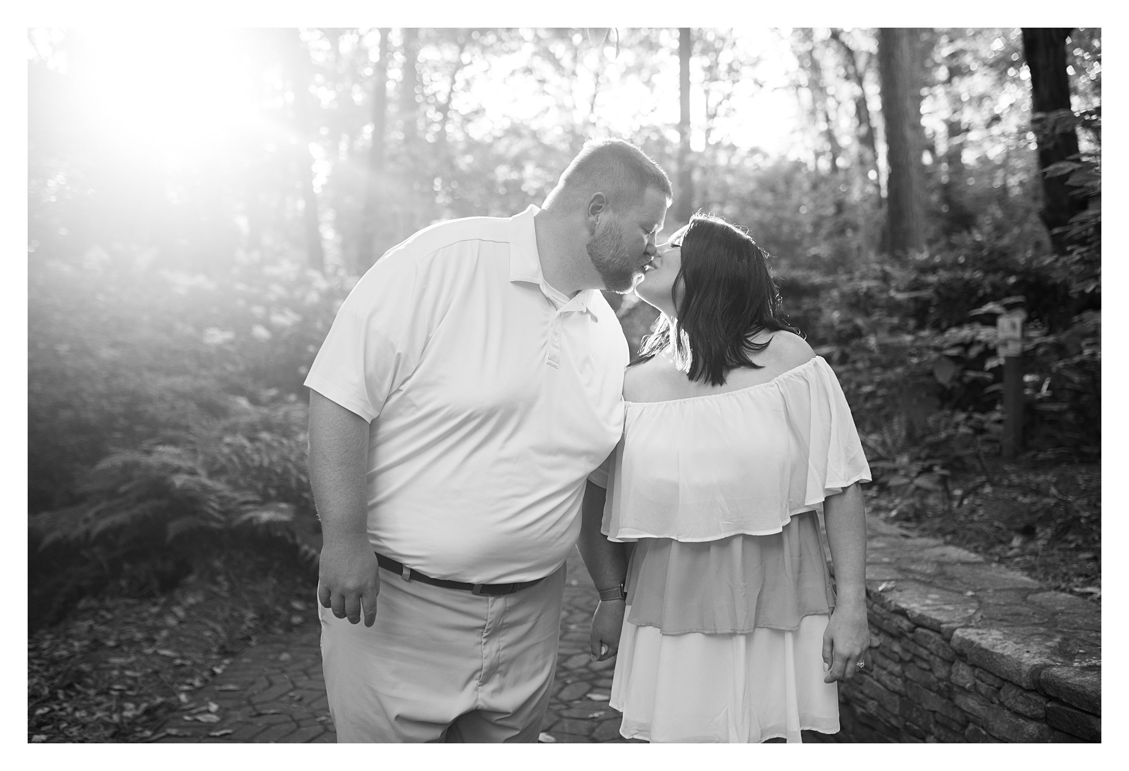 Black and white kissing photo of engagement Anniversary Photo Session